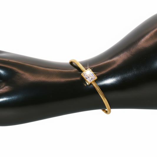 Gold bracelet with a square gemstone