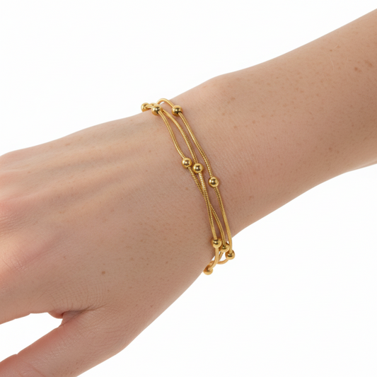 Gold bracelet with stones