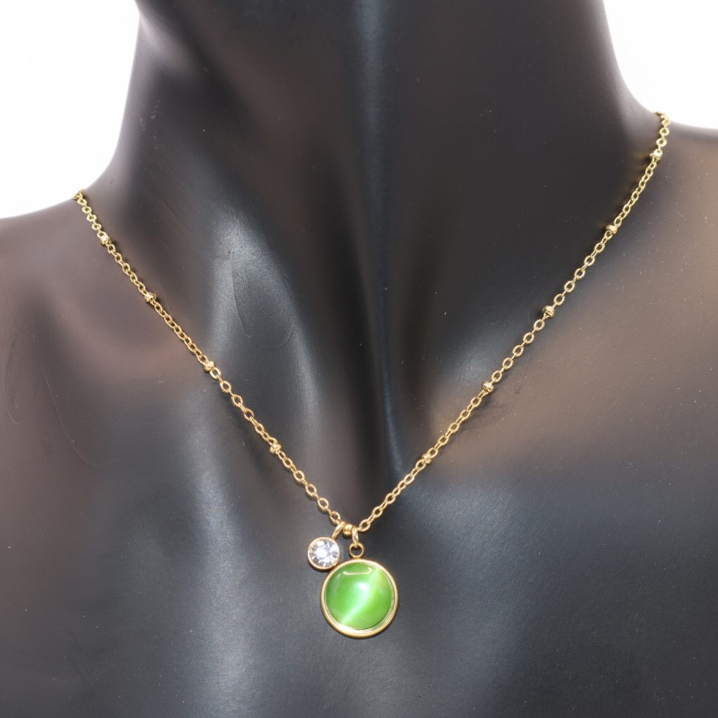 Gold necklace with a green pendant
