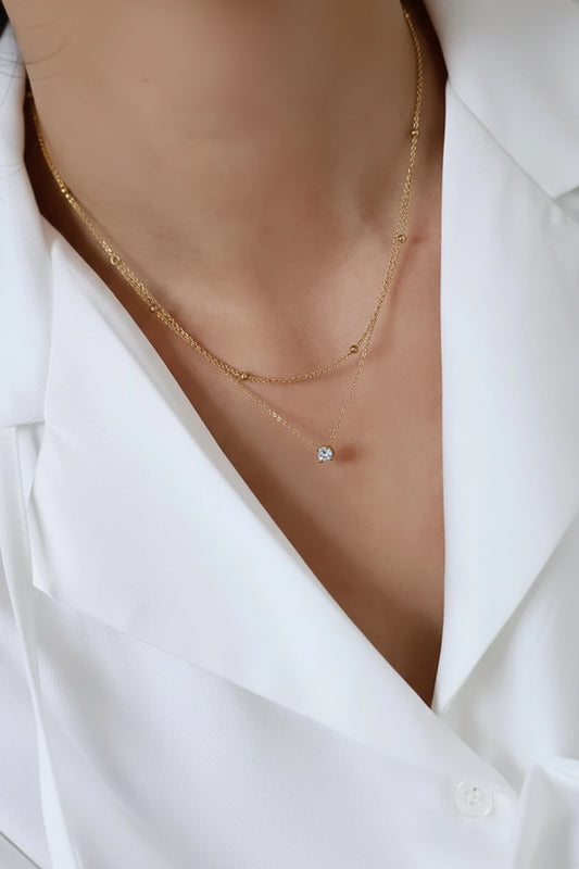 Gold necklace with a small pendant