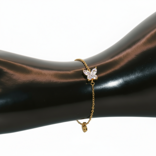 Gold bracelet with a butterfly charm