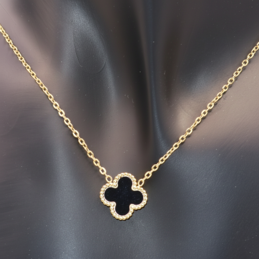 Gold necklace with a Black clover-shaped pendant