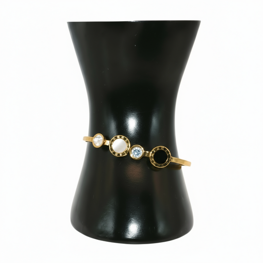 Gold bracelet with circular stones