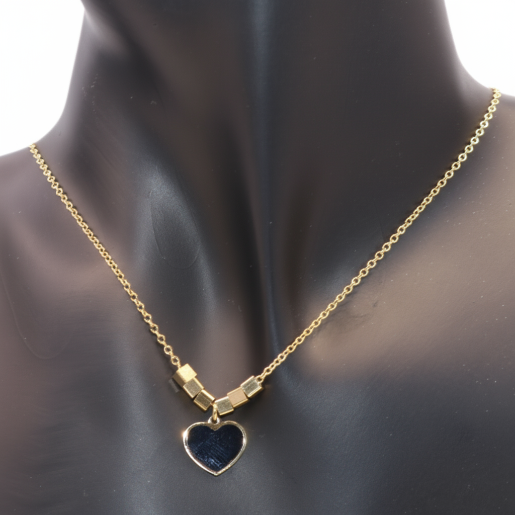 Gold necklace with a heart -shaped pendant