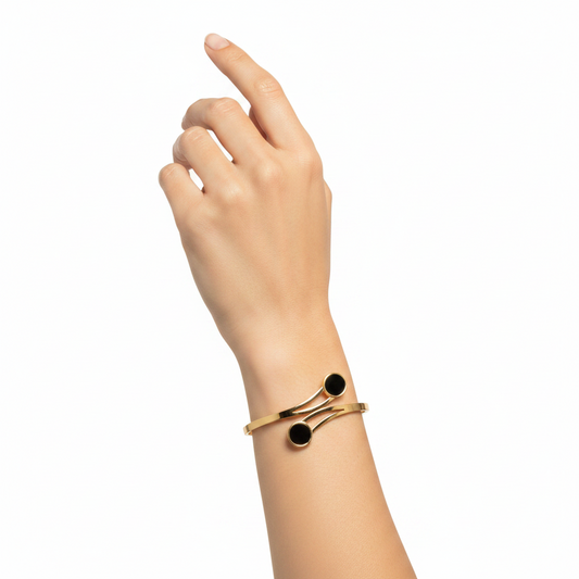 Gold bracelet with black stones