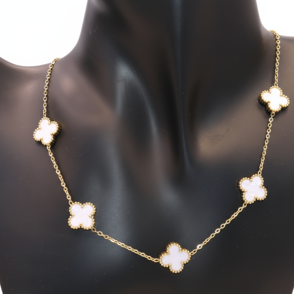 gold necklace with white clover