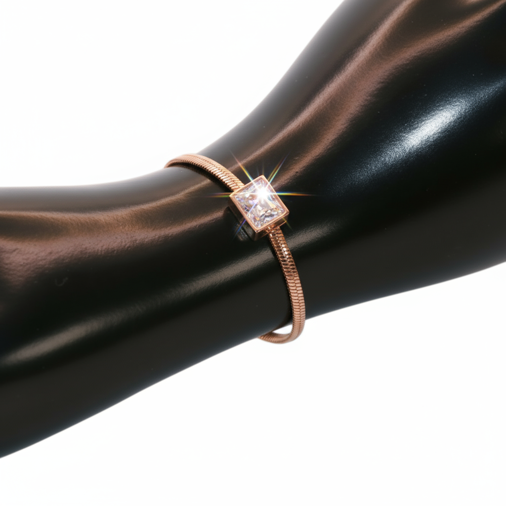 Rose gold bracelet with a square gemstone.