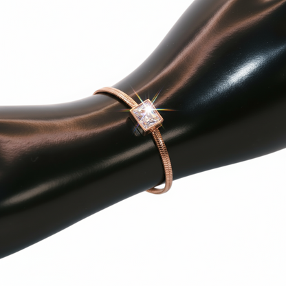 Rose gold bracelet with a square gemstone.