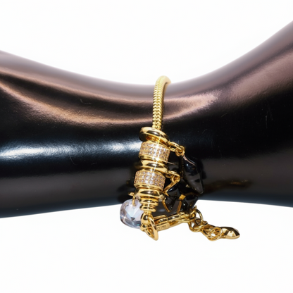 Gold bracelet with a clear crystal Black  charm 