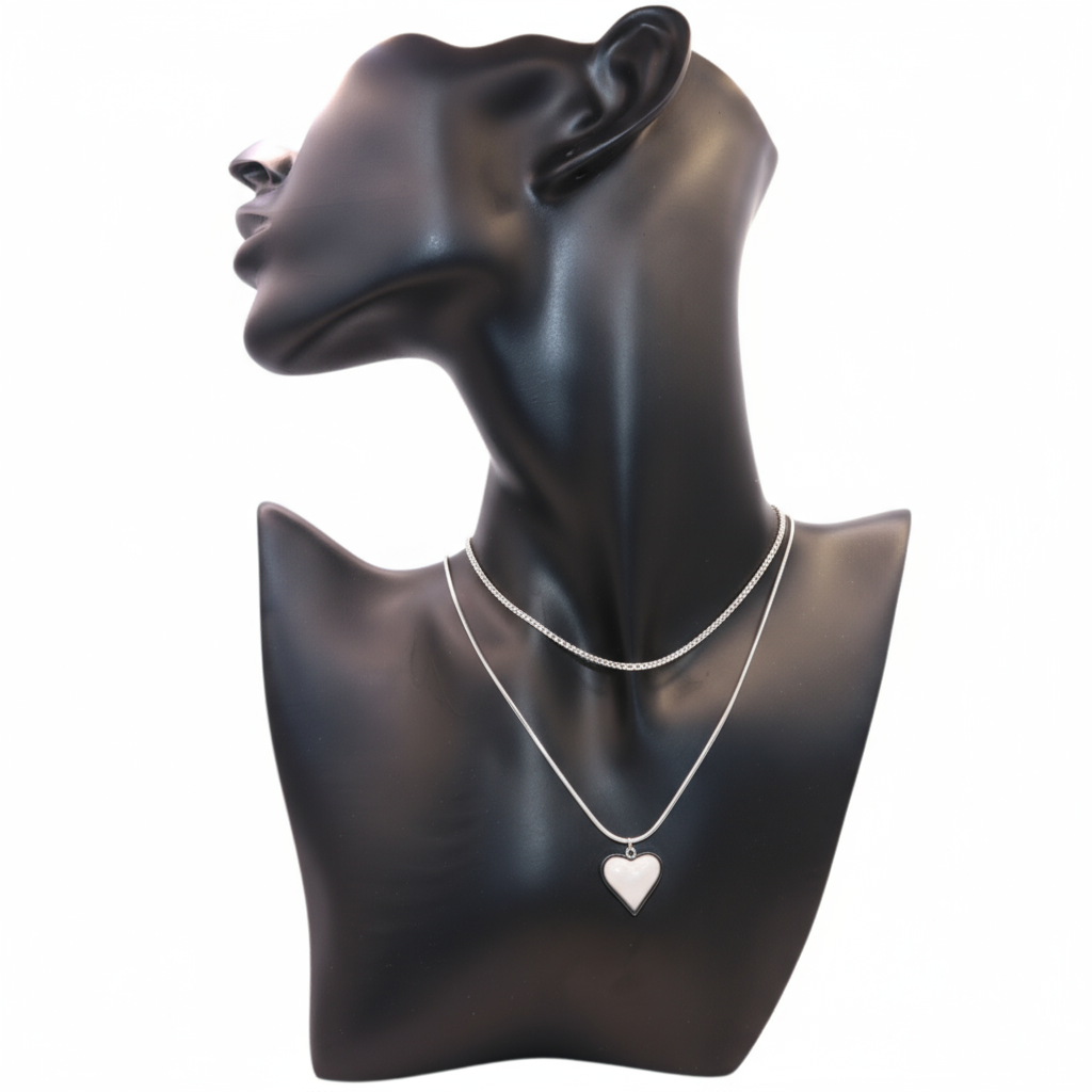 a silver necklace featuring a heart pendant