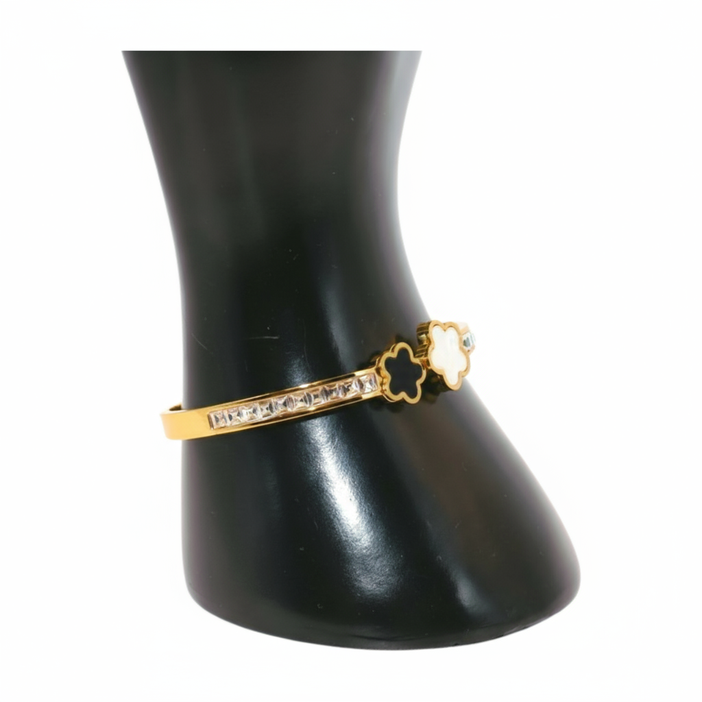 Gold bracelet with white and black Clover