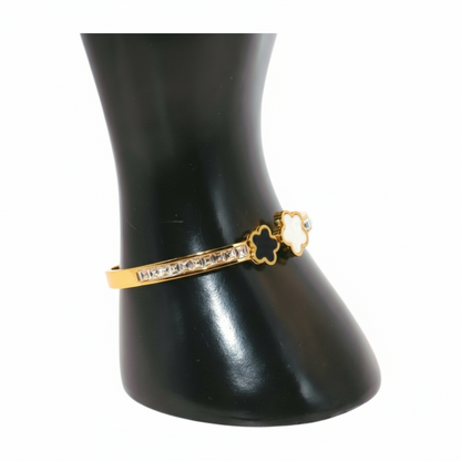 Gold bracelet with white and black Clover