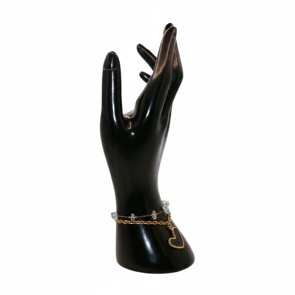 a gold  Black bracelet with heart charm 