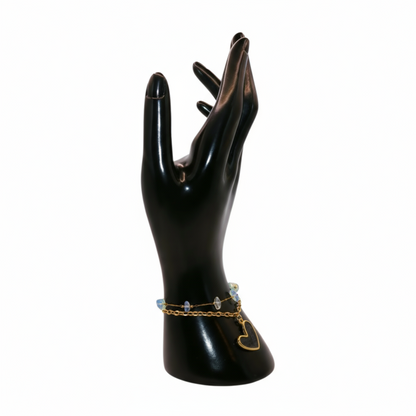 a gold  Black bracelet with heart charm 