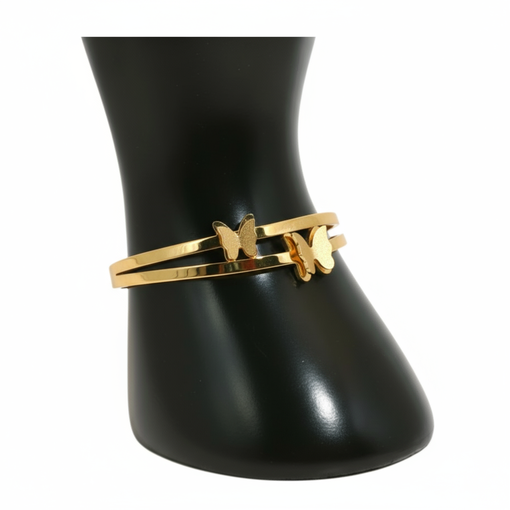 Gold bracelet with a butterfly charm 