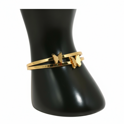 Gold bracelet with a butterfly charm 