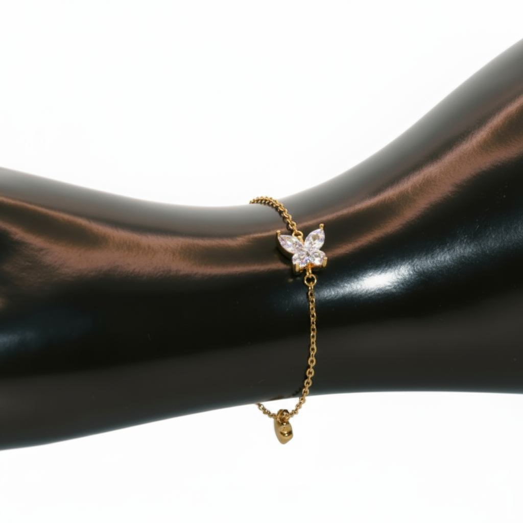 Gold bracelet with a butterfly charm
