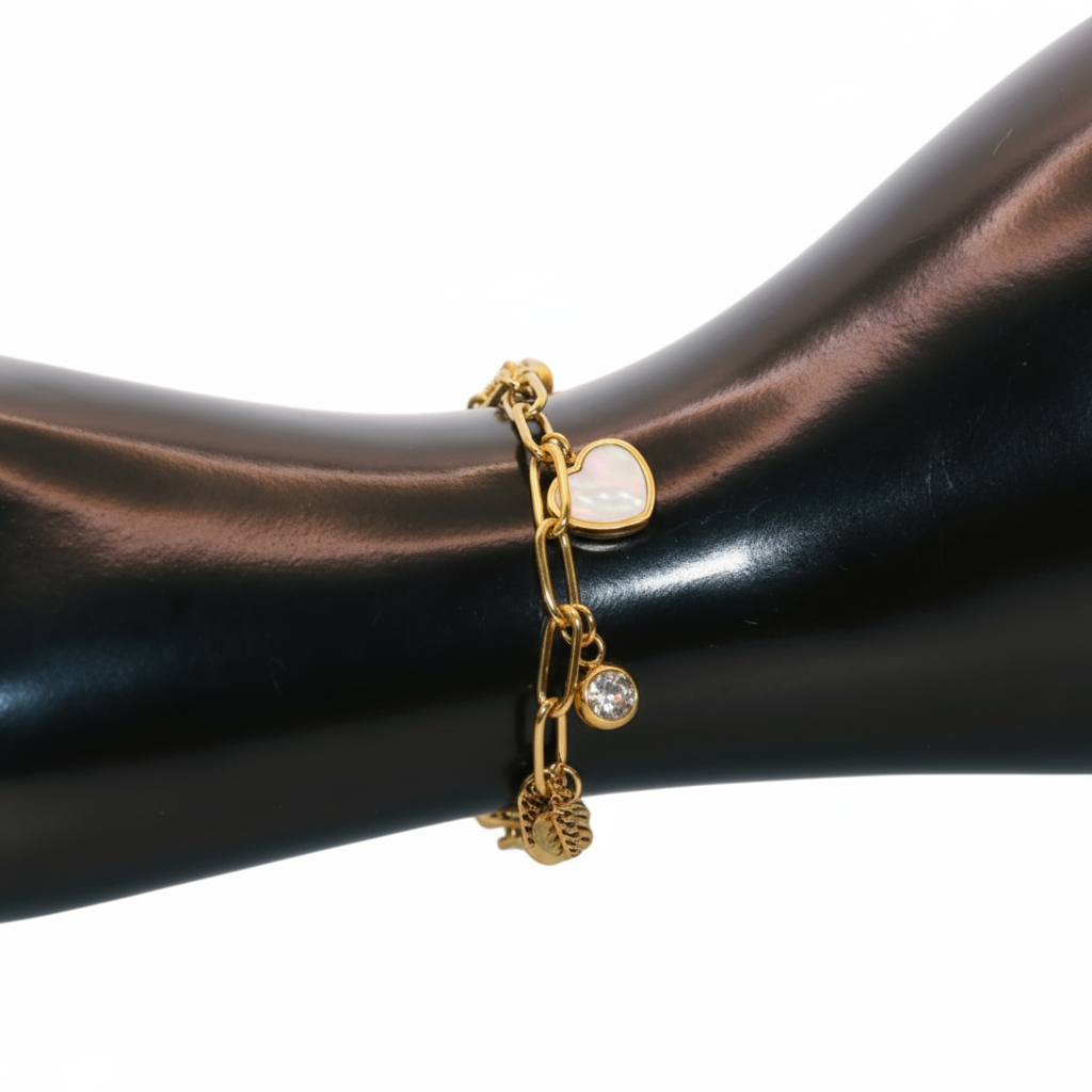 Gold bracelet with heart and round charm 