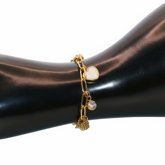 Gold bracelet with heart and round charm 