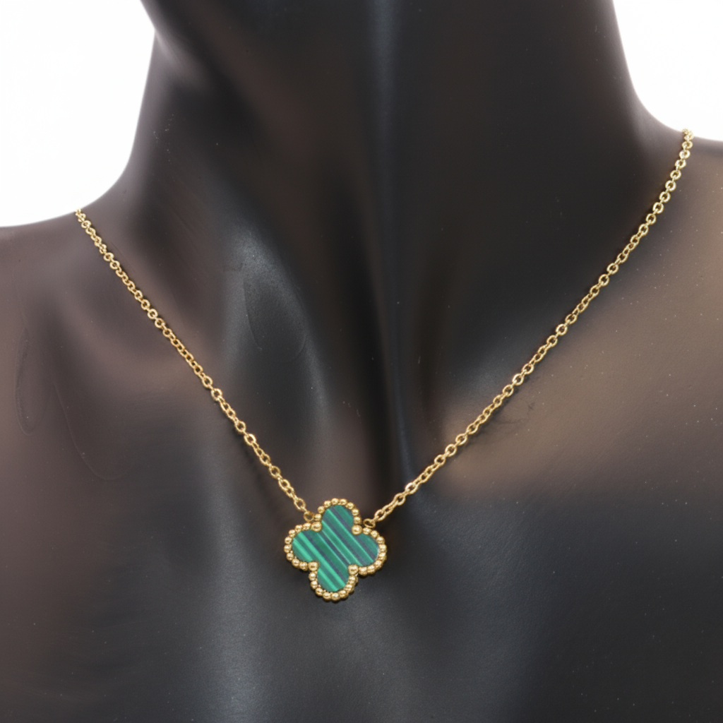 Gold necklace with a Green clover-shaped pendant 