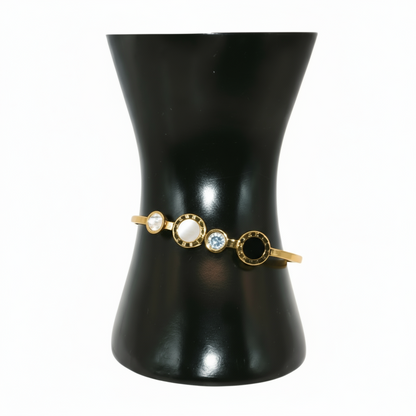 Gold bracelet with circular stones 