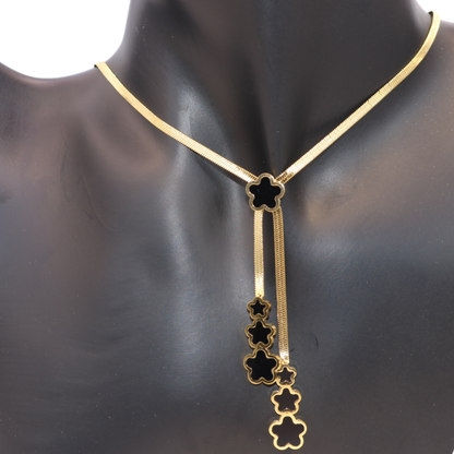 Gold necklace with black star-shaped pendant