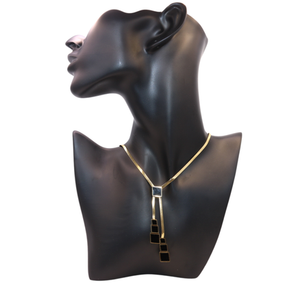Gold necklace with black pendant