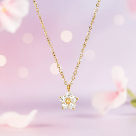Gold necklace with a floral pendant 