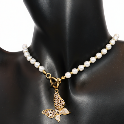 Pearl necklace with a gold butterfly pendant 