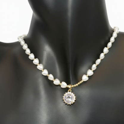 Pearl necklace with a gold chain and diamond pendant 