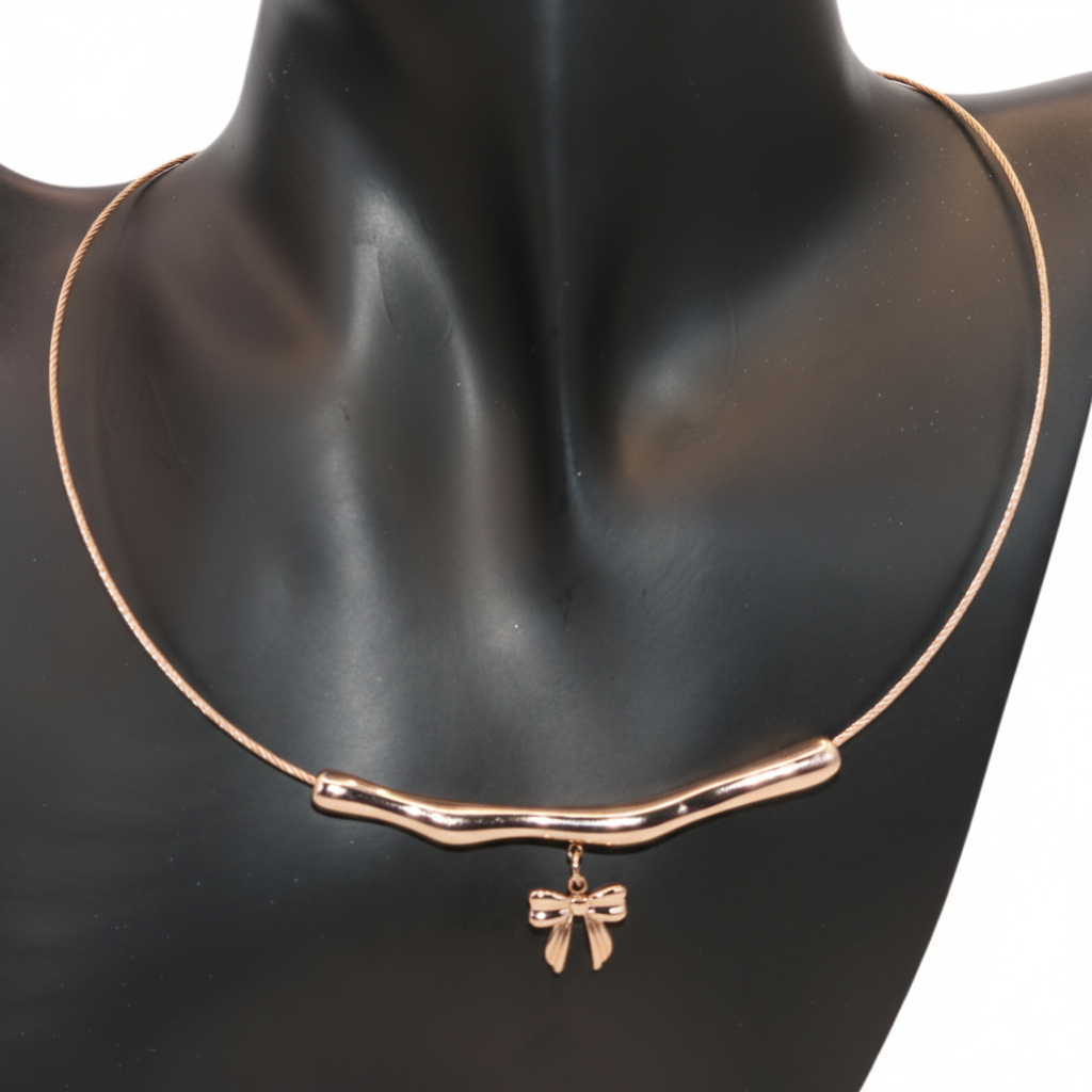 Rose gold necklace with a bow pendant 
