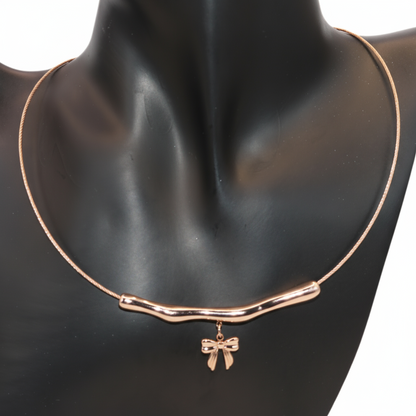 Rose gold necklace with a bow pendant 