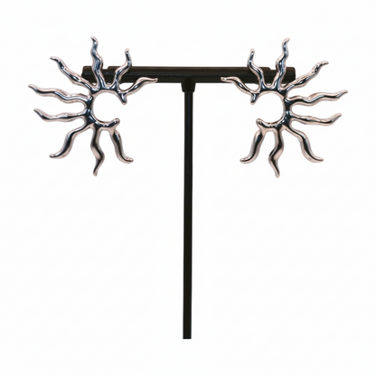 Pair of silver sun-shaped earrings 